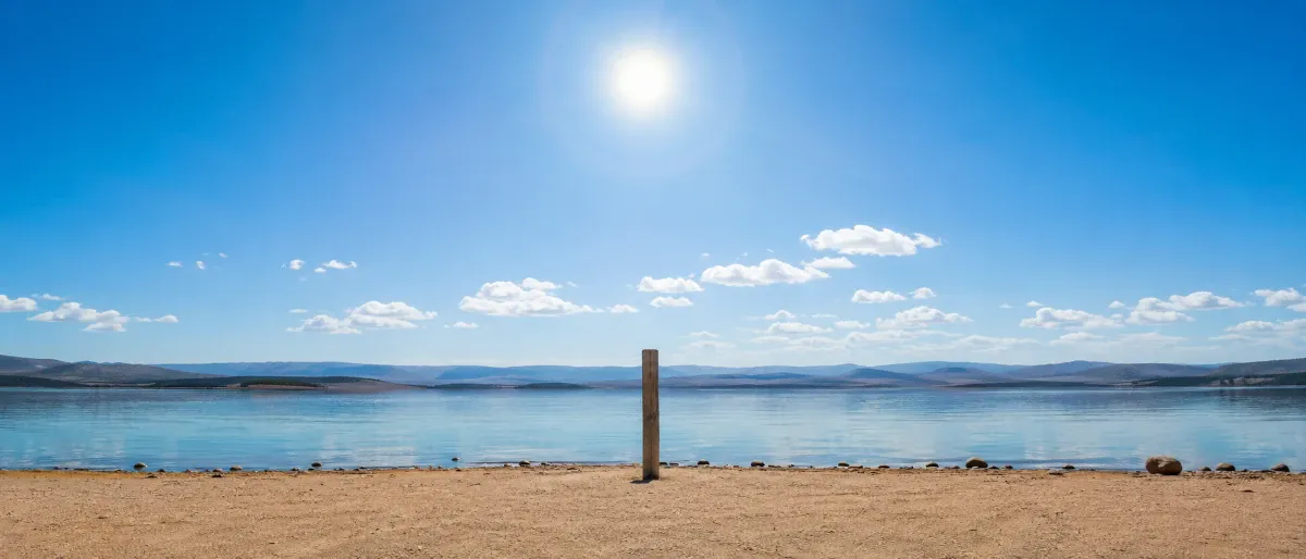 Sun at solar noon casting a short shadow